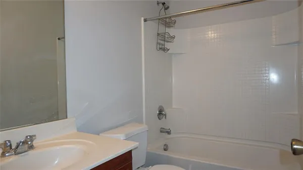a bathroom with a sink and shower
