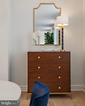a kitchen with stainless steel appliances a sink a table and chairs
