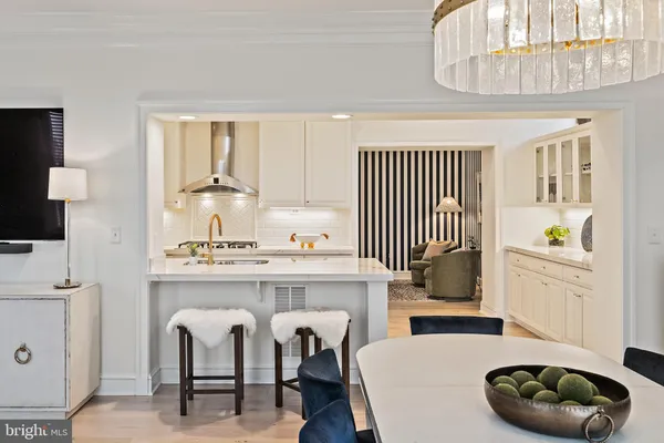 a kitchen with a sink a stove and a cabinets