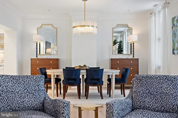 a view of a dining room with furniture and window