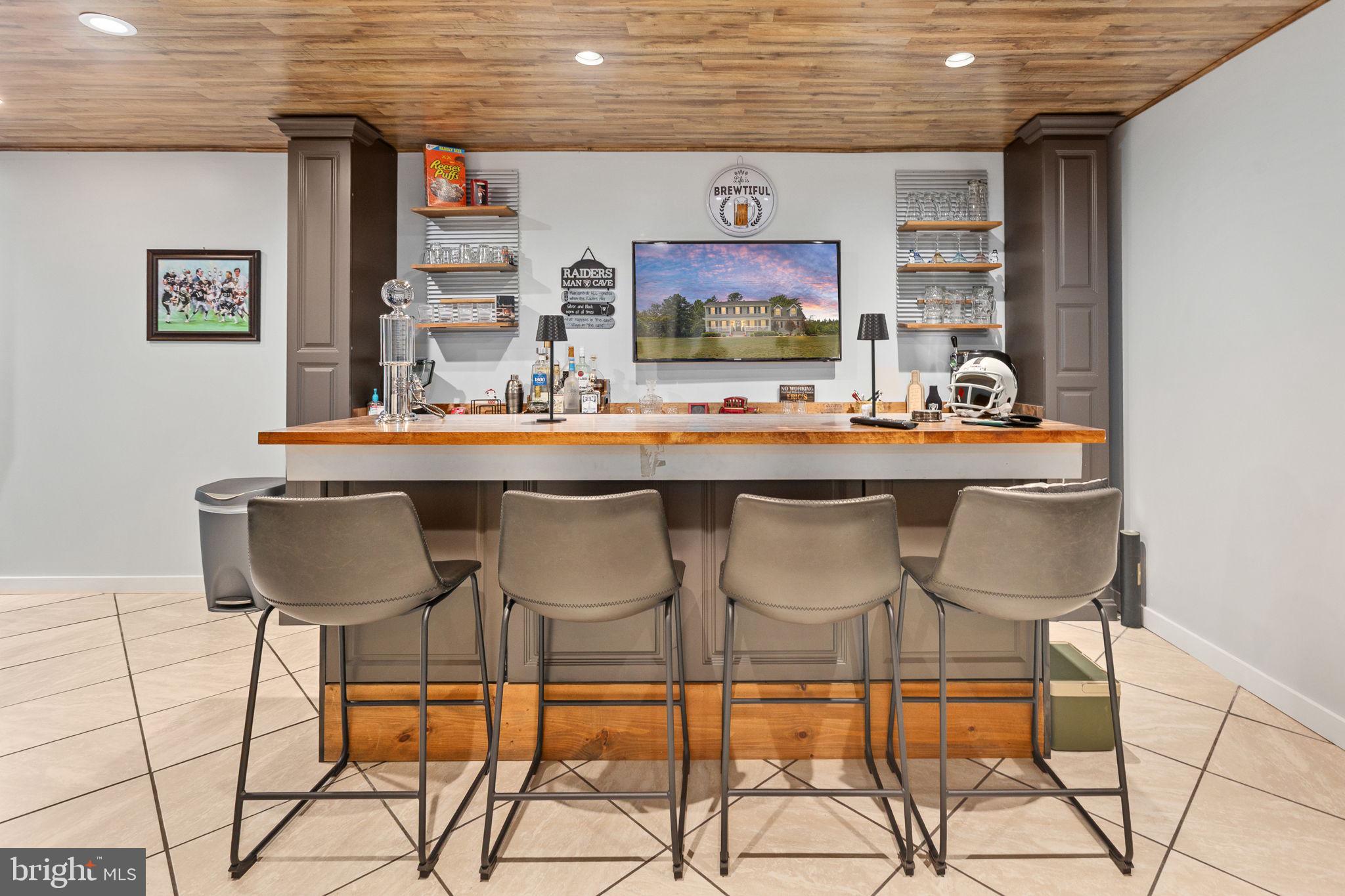 22088 Landora Bridge Road Ruther Glen, VA 22546 - Photo 77 of 122 Stylish home bar with modern flair.