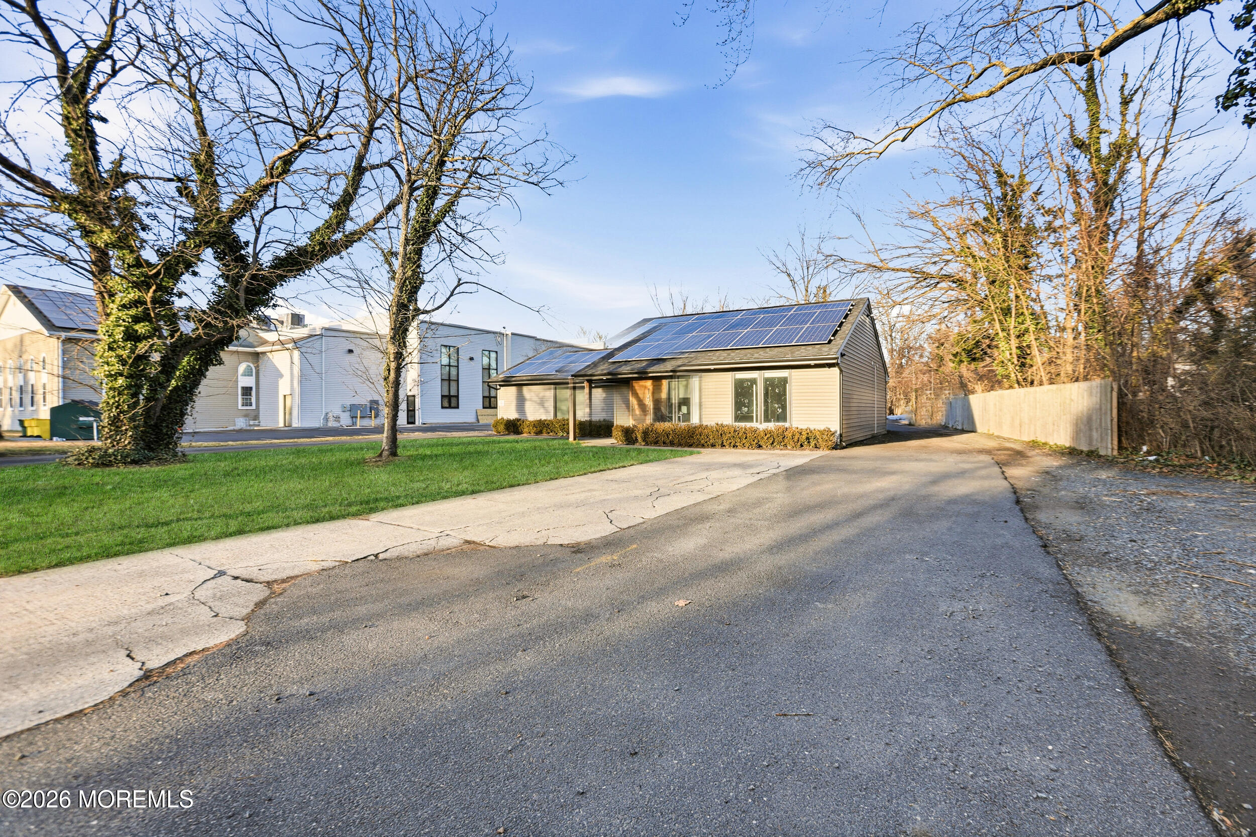 1465 Lanes Mill Road Lakewood, NJ 08701 - Photo 4 of 15 a front view of house with yard and green space