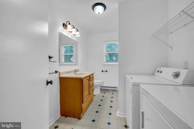 a bathroom with a sink a vanity and a mirror