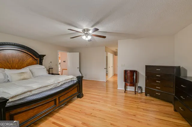 a bedroom with a bed and dresser