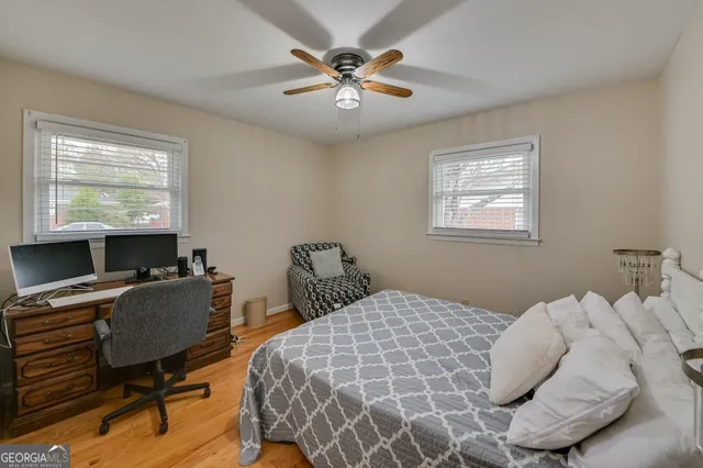 a bedroom with bed and a window