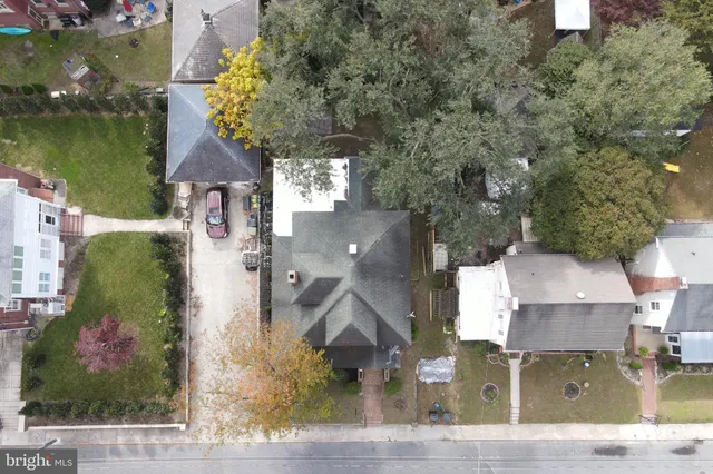 an aerial view of houses with outdoor space