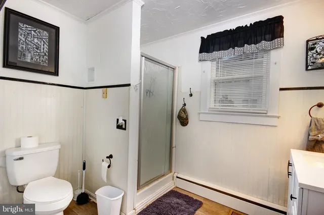 a white toilet sitting next to a bathroom sink