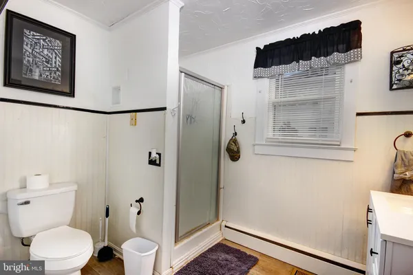a white toilet sitting next to a bathroom sink