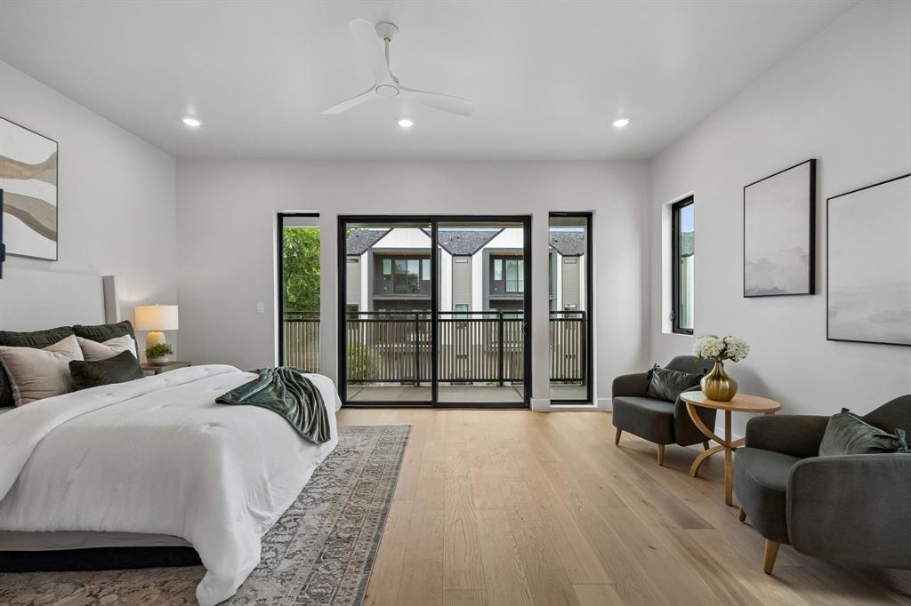 4615 Rusk Avenue Dallas, TX 75204 - Photo 15 of 25 a large bedroom with bed and glass door