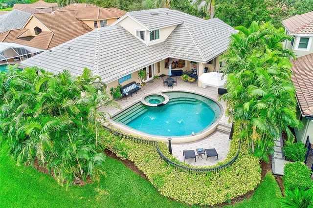 a dining room filled with furniture and wooden floor