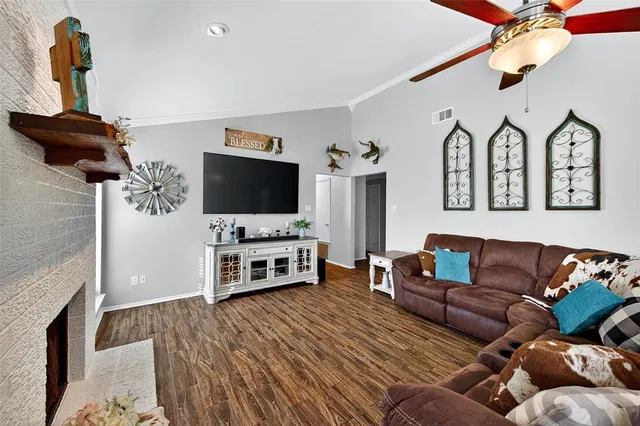 a living room with furniture and a flat screen tv