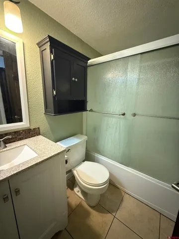 a kitchen with a white cabinets and white appliances