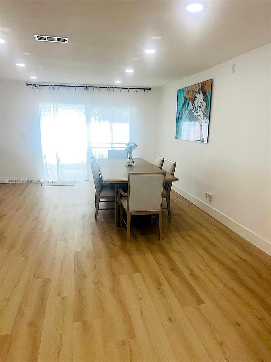 9703 Southwest 2nd Street Boca Raton, FL 33428 - Photo 14 of 17 a view of a work space with wooden floor and furniture