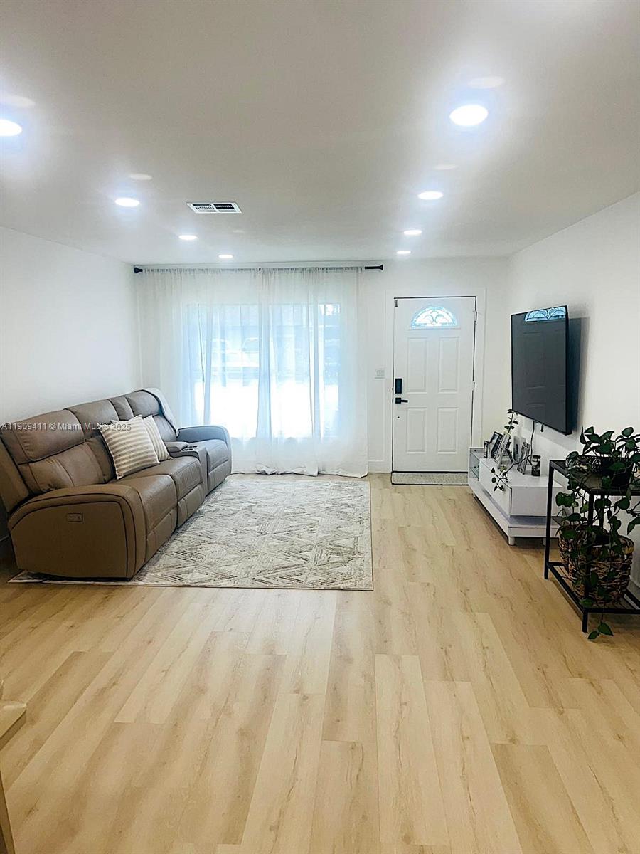 9703 Southwest 2nd Street Boca Raton, FL 33428 - Photo 16 of 17 a bedroom with furniture and a flat screen tv