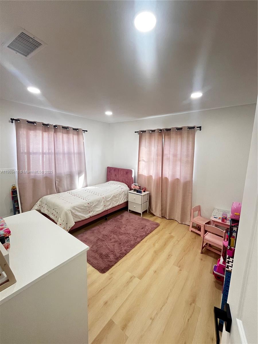 9703 Southwest 2nd Street Boca Raton, FL 33428 - Photo 17 of 17 a bedroom with two beds and a large window