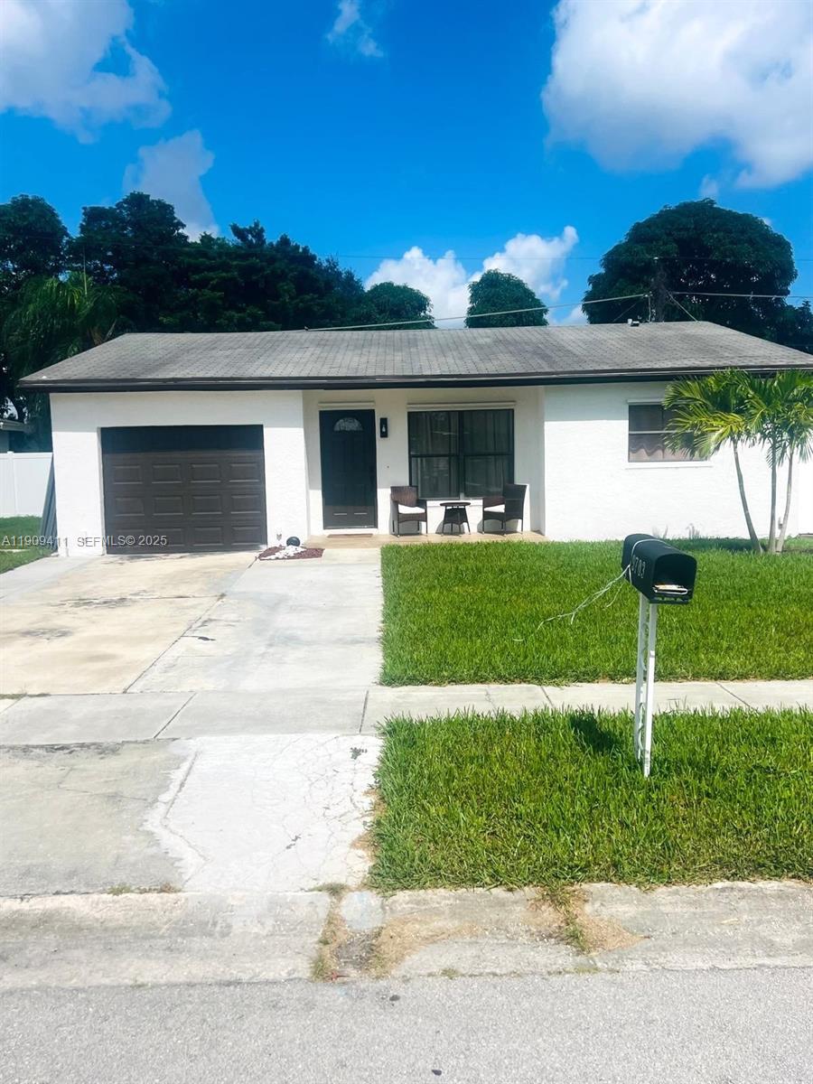 9703 Southwest 2nd Street Boca Raton, FL 33428 - Photo 6 of 17 a view of a house with backyard and garden