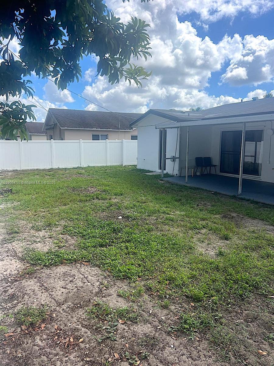 9703 Southwest 2nd Street Boca Raton, FL 33428 - Photo 8 of 17 a backyard of a house with lots of green space