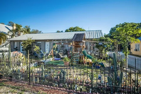 a front view of a house with a yard and balcony