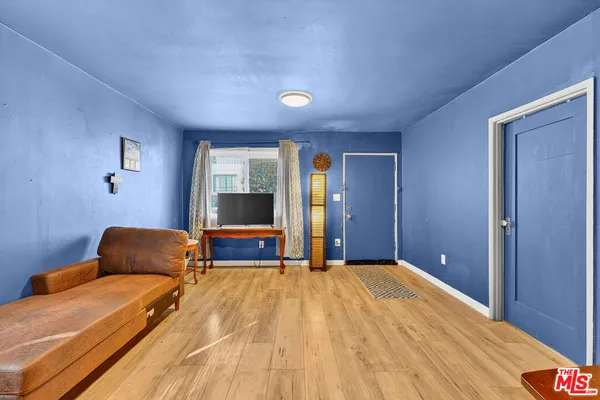 a bedroom with a bed and a couch