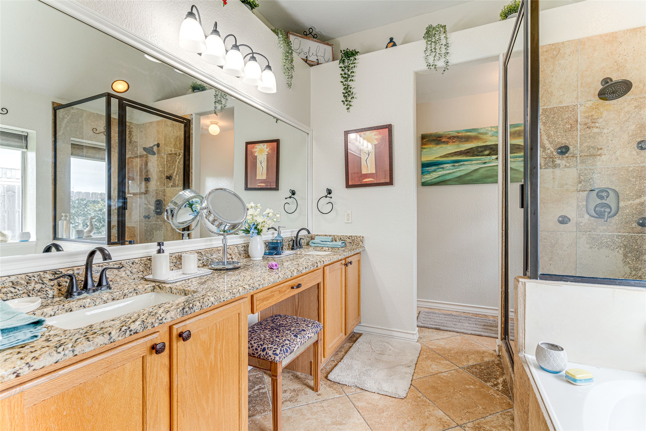 1209 Lacey Oak Loop Round Rock, TX 78681 - Photo 19 of 22 Dual sink vanity with granite-style countertop, wood cabinetry, and a full-width mirror