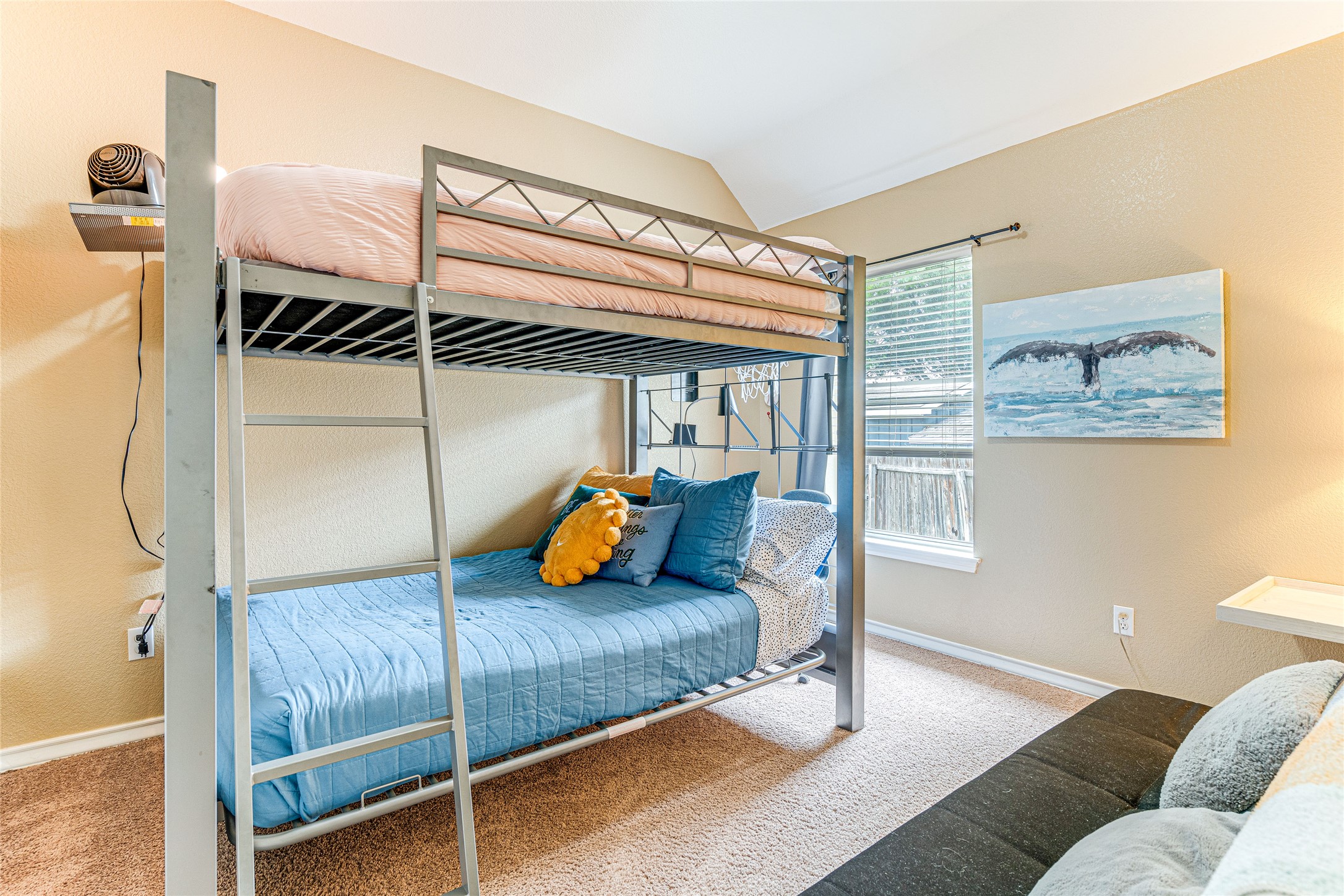 1209 Lacey Oak Loop Round Rock, TX 78681 - Photo 20 of 22 Room featuring a metal bunk bed frame with integrated ladder, a window with horizontal blinds, and neutral-toned carpeting