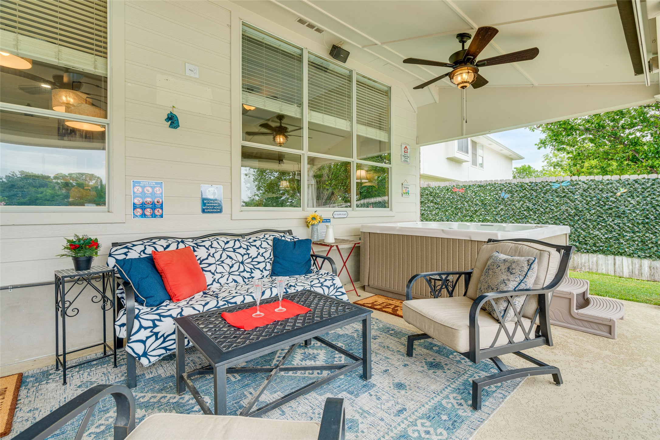 1209 Lacey Oak Loop Round Rock, TX 78681 - Photo 10 of 22 Covered patio featuring a built-in hot tub, concrete flooring, and a ceiling fan