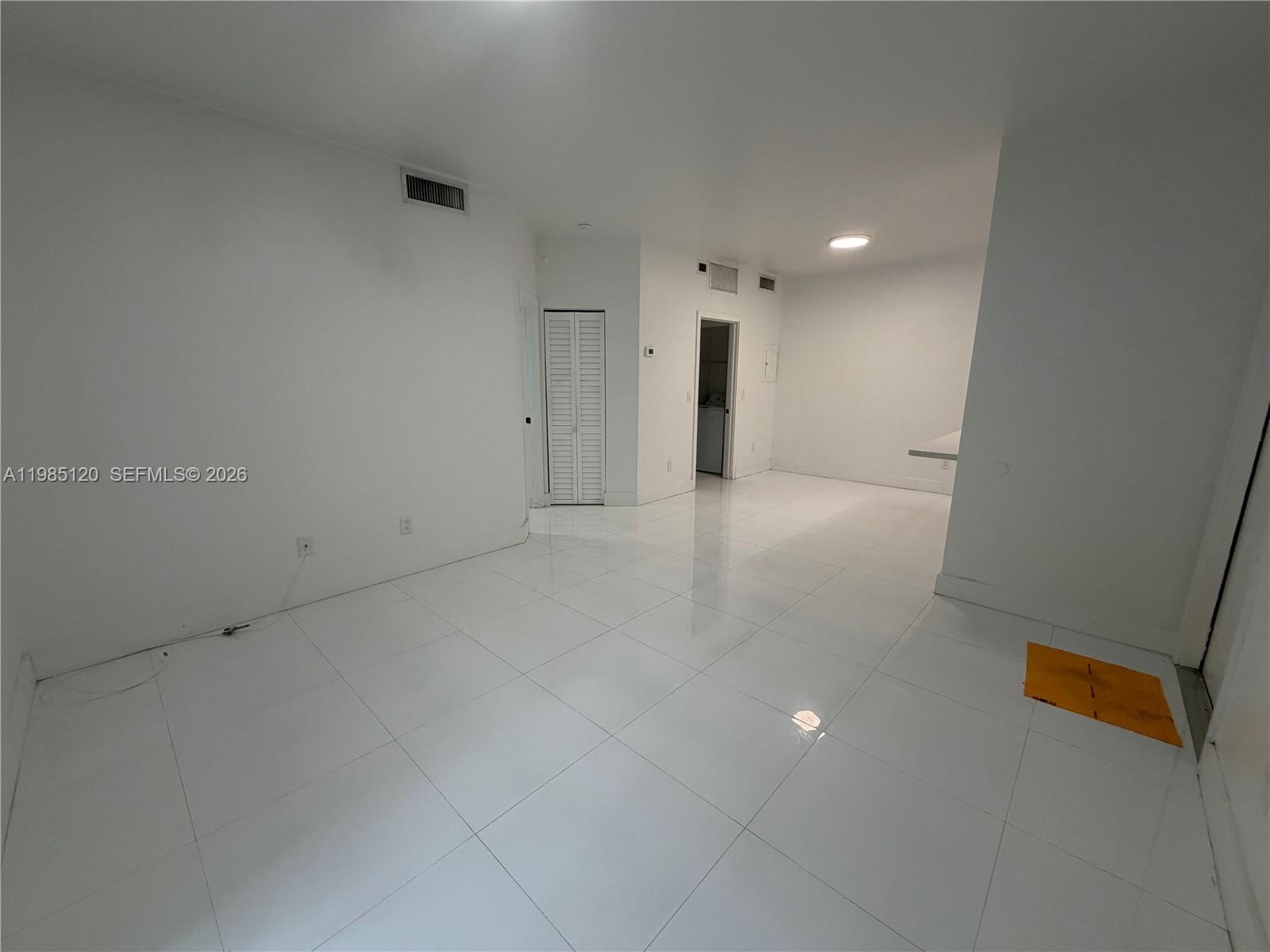 18328 Northwest 68th Avenue, Unit I Hialeah, FL 33015 - Photo 3 of 15 a view of an empty room