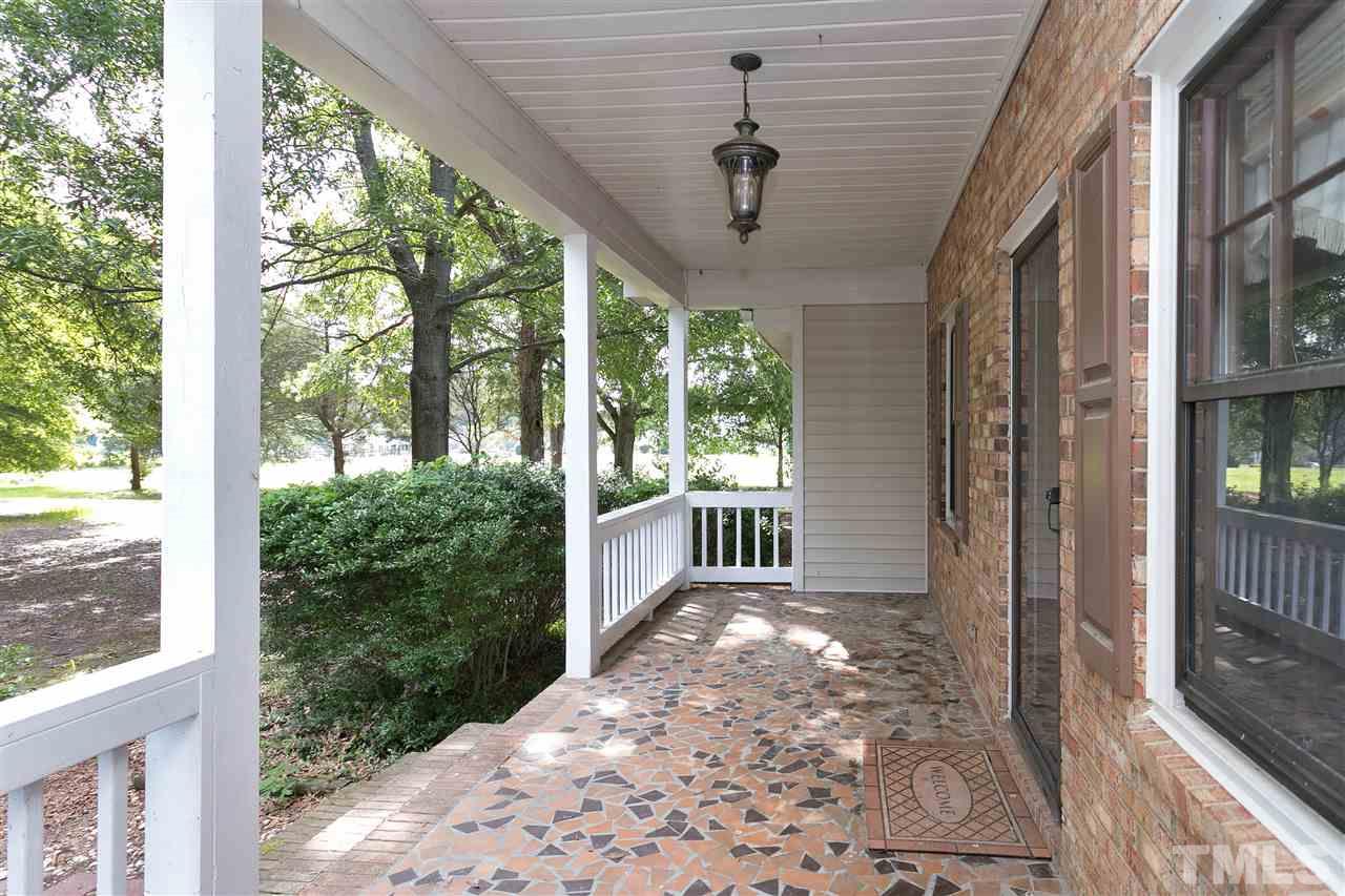10036 Ten-Ten Road Raleigh, NC 27603 - Photo 2 of 25 a view of a porch with a porch