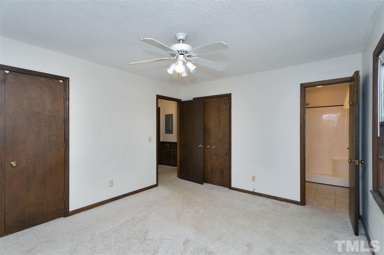 10036 Ten-Ten Road Raleigh, NC 27603 - Photo 15 of 25 a view of an empty room with a ceiling fan