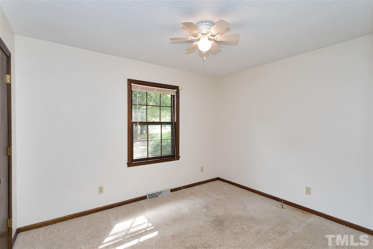 10036 Ten-Ten Road Raleigh, NC 27603 - Photo 18 of 25 an empty room with a window
