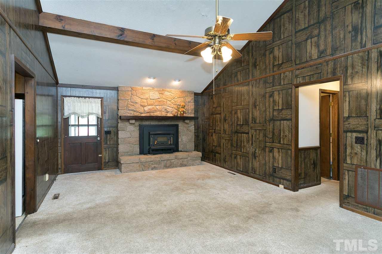 10036 Ten-Ten Road Raleigh, NC 27603 - Photo 3 of 25 a view of an empty room with a fireplace