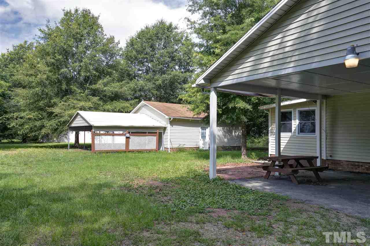 10036 Ten-Ten Road Raleigh, NC 27603 - Photo 22 of 25 a backyard of a house with table and chairs