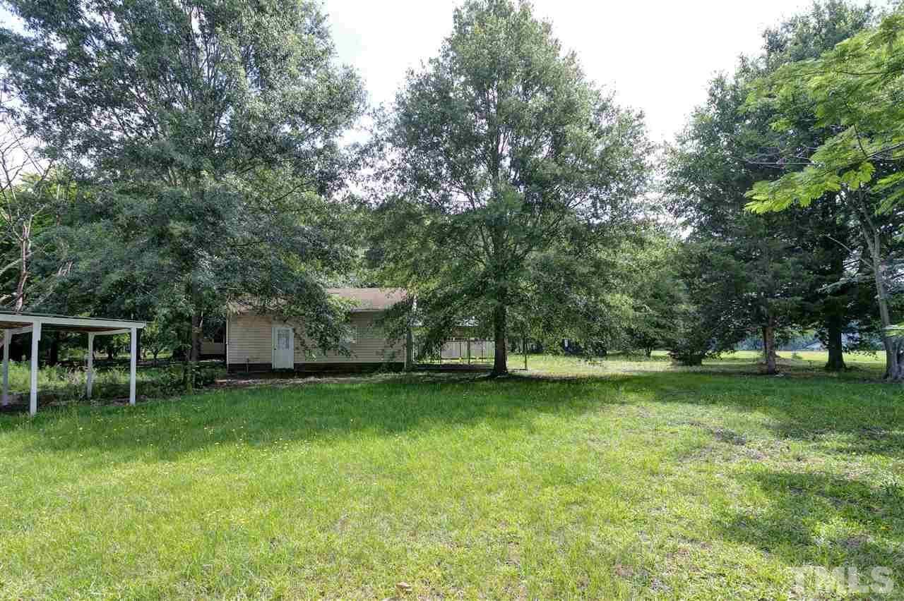 10036 Ten-Ten Road Raleigh, NC 27603 - Photo 25 of 25 a view of a backyard with a garden and entertaining space