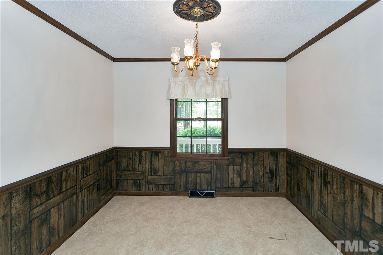 10036 Ten-Ten Road Raleigh, NC 27603 - Photo 7 of 25 a view of entryway with a chandelier fan