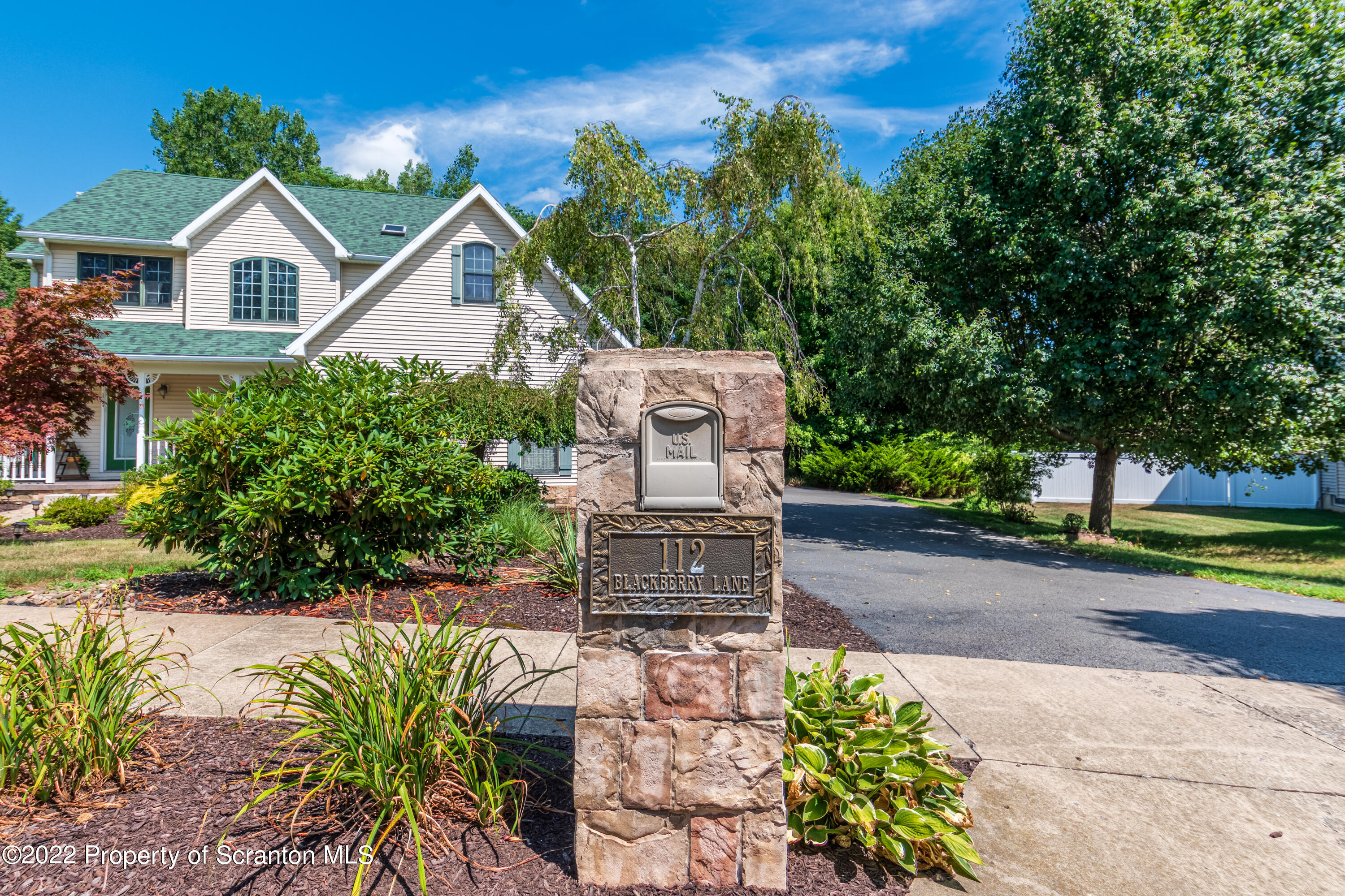 112 Blackberry Lane Duryea, PA 18642 - Photo 2 of 29 a front view of a house with a garden