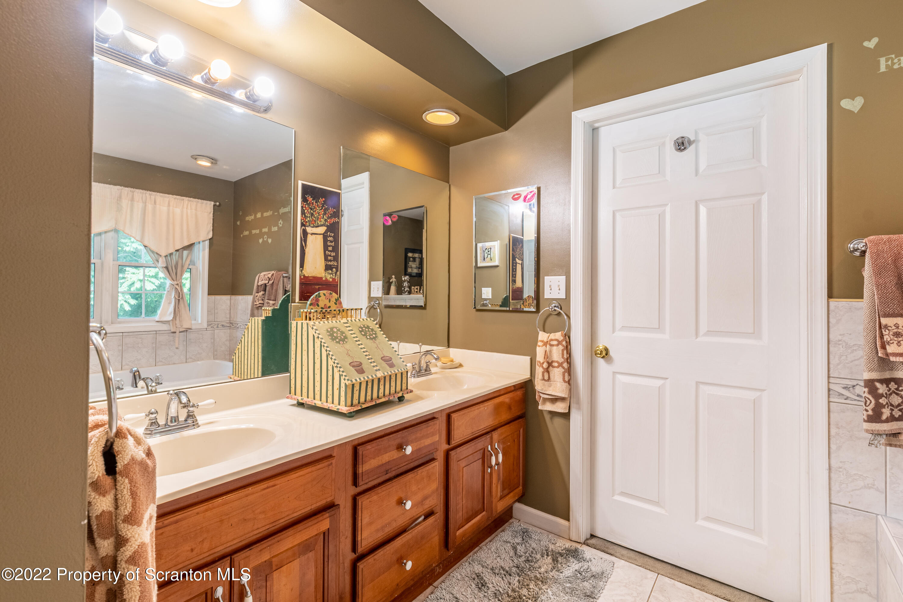 112 Blackberry Lane Duryea, PA 18642 - Photo 21 of 29 a bathroom with a sink vanity and mirror