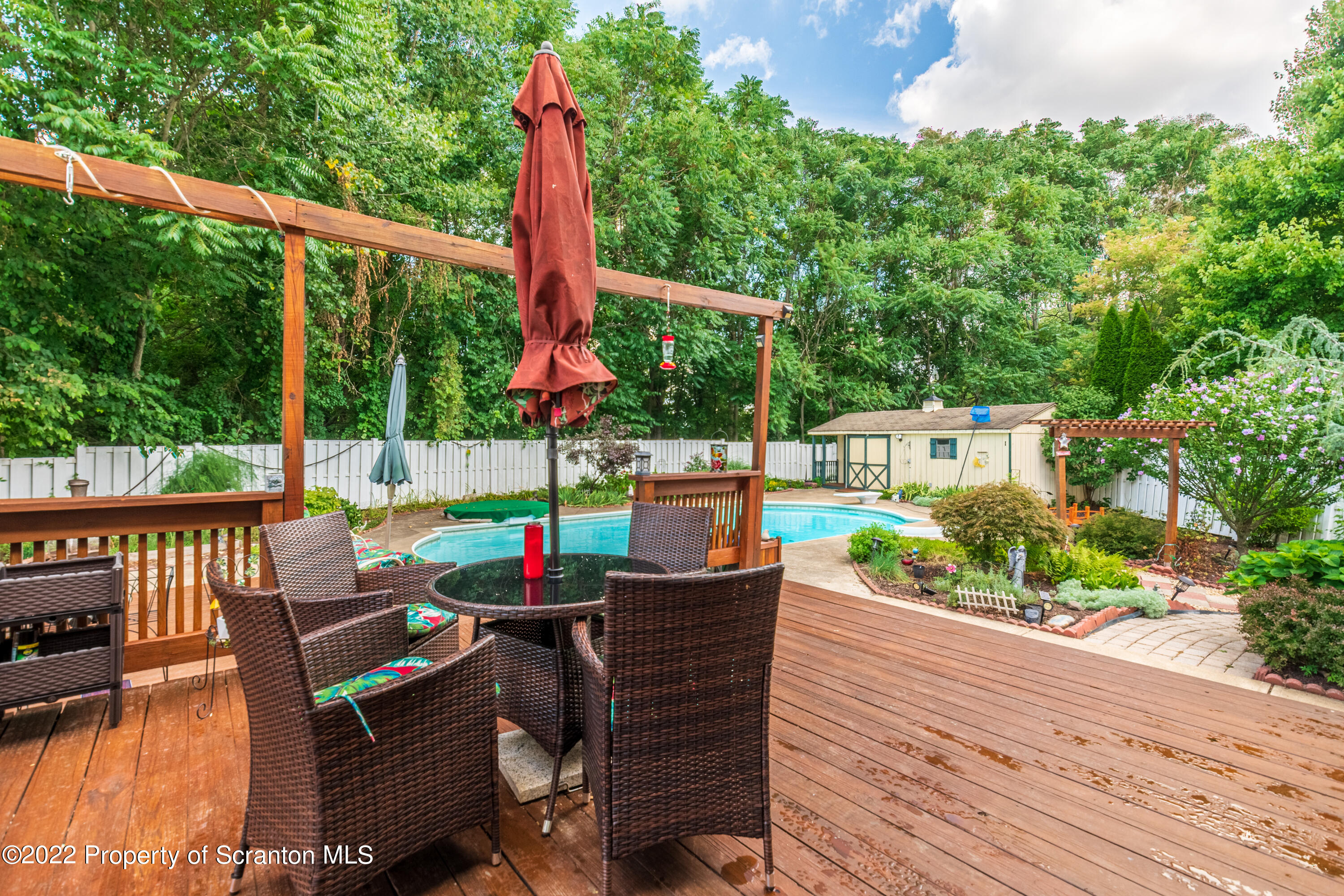 112 Blackberry Lane Duryea, PA 18642 - Photo 25 of 29 a view of a patio with a table chairs and a backyard