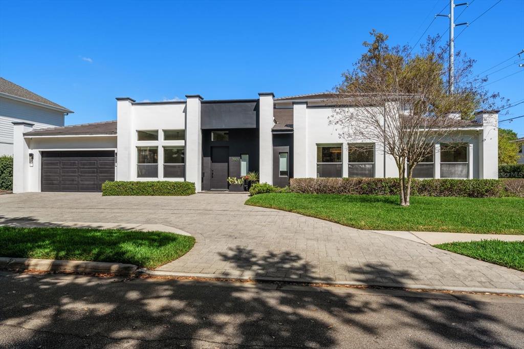 3901 West Granada Street Tampa, FL 33629 - Photo 1 of 45 front view of a house with a yard