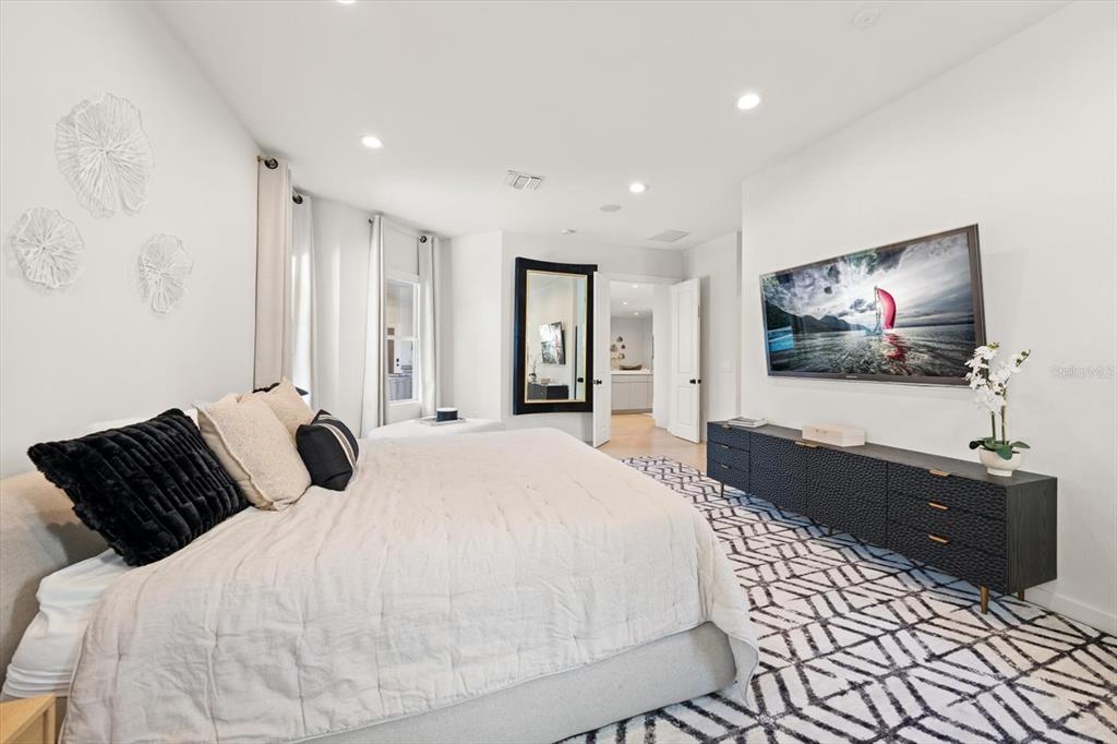 3901 West Granada Street Tampa, FL 33629 - Photo 17 of 45 a bedroom with a bed and a flat screen tv