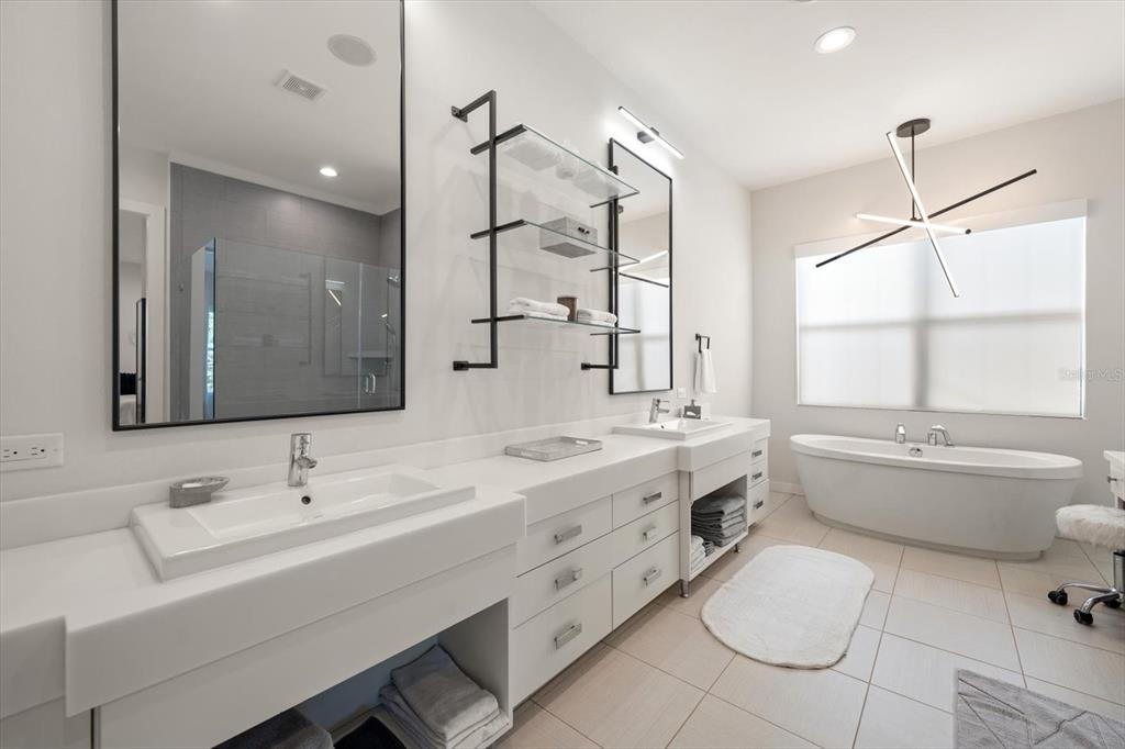 3901 West Granada Street Tampa, FL 33629 - Photo 19 of 45 a bathroom with a granite countertop sink mirror vanity bathtub and toilet