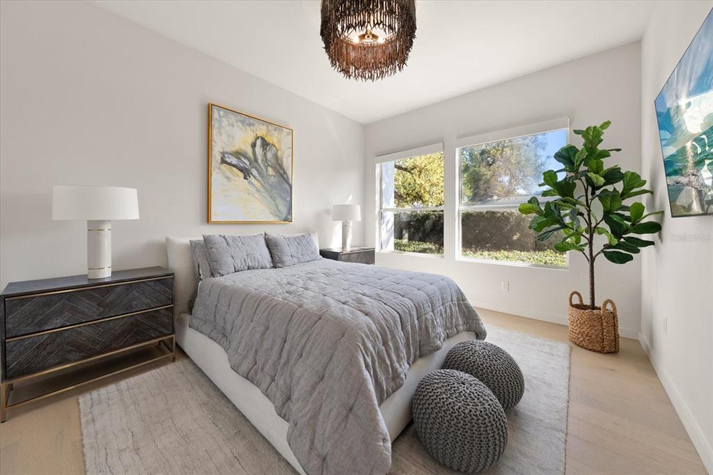 3901 West Granada Street Tampa, FL 33629 - Photo 27 of 45 a bedroom with a bed and a potted plant