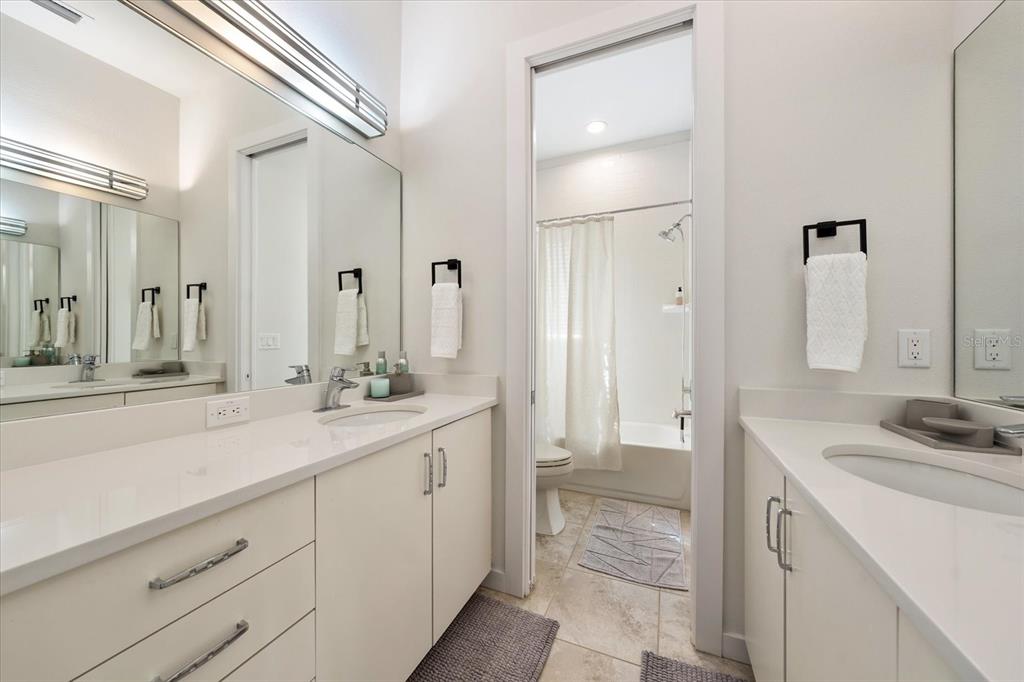 3901 West Granada Street Tampa, FL 33629 - Photo 28 of 45 a spacious bathroom with a shower sink and mirror