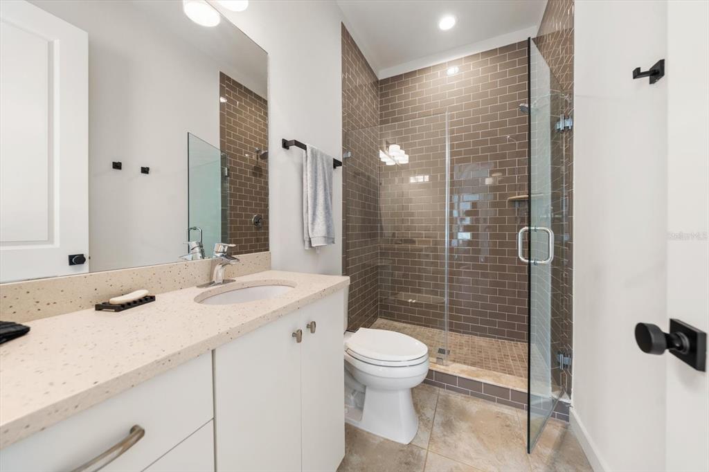 3901 West Granada Street Tampa, FL 33629 - Photo 31 of 45 a bathroom with a sink toilet and shower