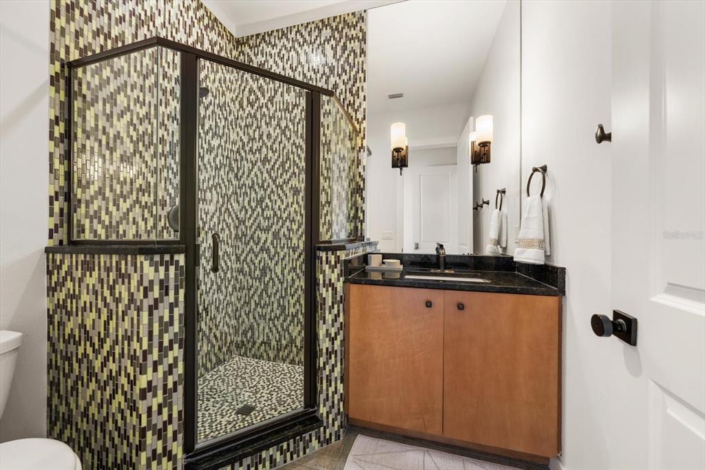 3901 West Granada Street Tampa, FL 33629 - Photo 39 of 45 a bathroom with a shower curtain and a sink