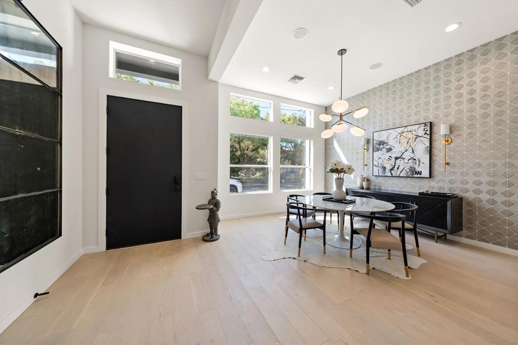 3901 West Granada Street Tampa, FL 33629 - Photo 4 of 45 a view of a dining room with furniture window and wooden floor