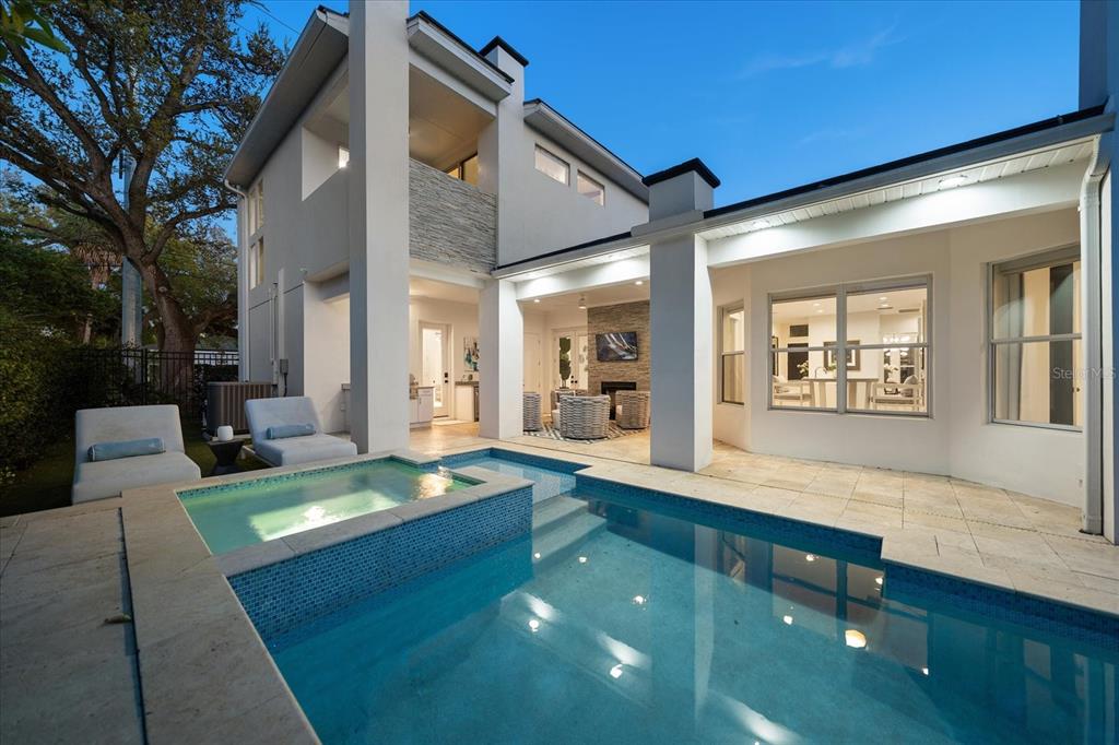 3901 West Granada Street Tampa, FL 33629 - Photo 42 of 45 a living room with dining table and couches with wooden floor