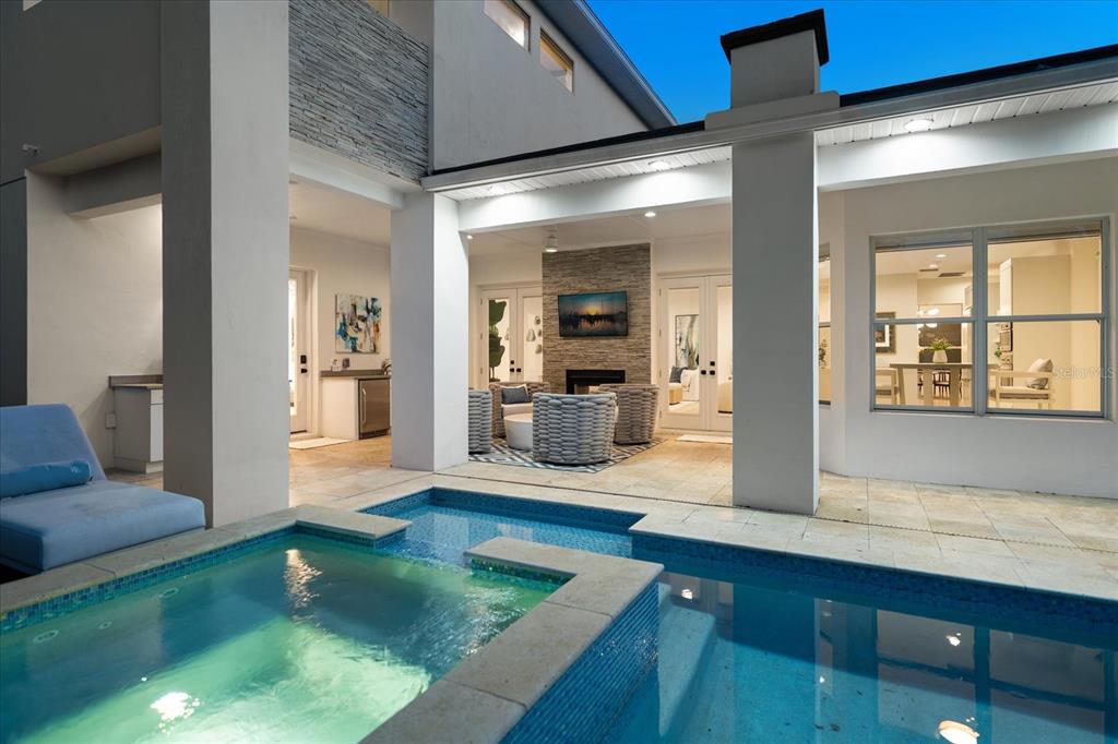 3901 West Granada Street Tampa, FL 33629 - Photo 43 of 45 a living room with couch and dining area with wooden floor