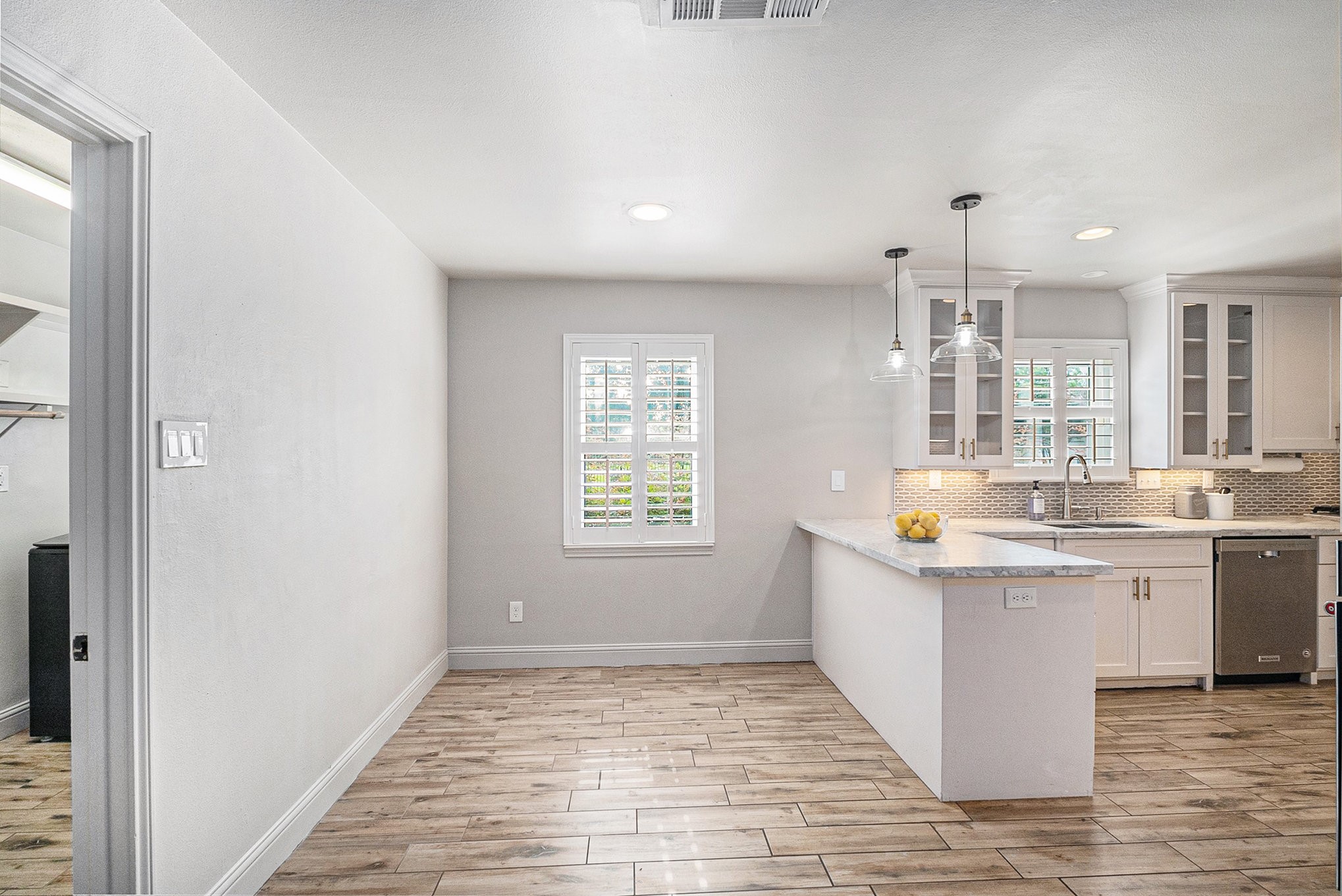 10602 Del Monte Drive Houston, TX 77042 - Photo 12 of 37 a kitchen with stainless steel appliances granite countertop a sink and a stove with wooden floor