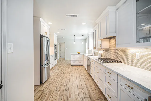 a large kitchen with a lot of counter space