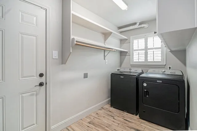 a kitchen with a refrigerator and window